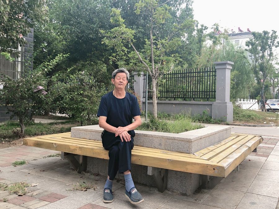 Tang Jinglin photographed at the Zhonglou Housing Estate in the county city of Fengyang, Anhui. He and his wife moved into a public rental unit here in 2013. (Photo: Tang Jinglin)