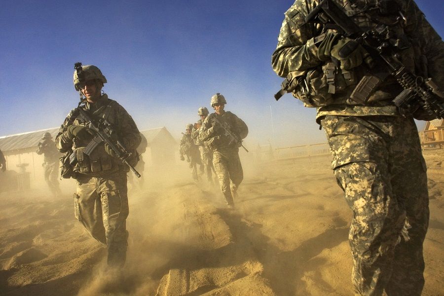 In this file photo taken on 28 November 2008, US Army soliders from 1-506 Infantry Division set out on a patrol in Paktika province, situated along the Afghan-Pakistan border. (David Furst/AFP)