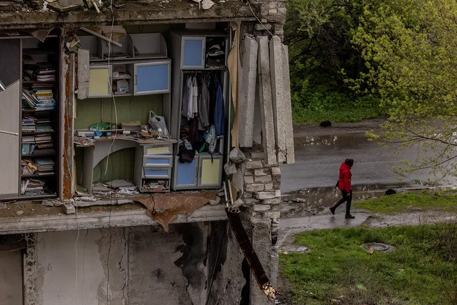 An apartment building destroyed by Russian shelling is seen in the outskirts of Izium, in Kharkiv region, Ukraine, 21 April 2023. (Carlos Barria/Reuters)