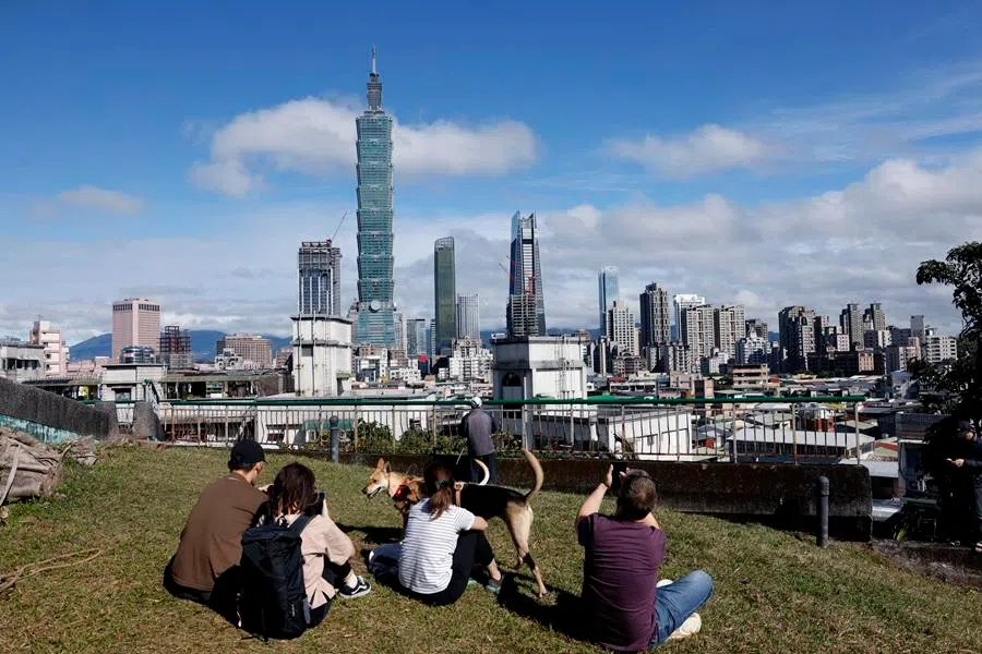 People watch the Taipei 101 on 25 January 2026 in Taipei, Taiwan. (Ann Wang/Reuters)