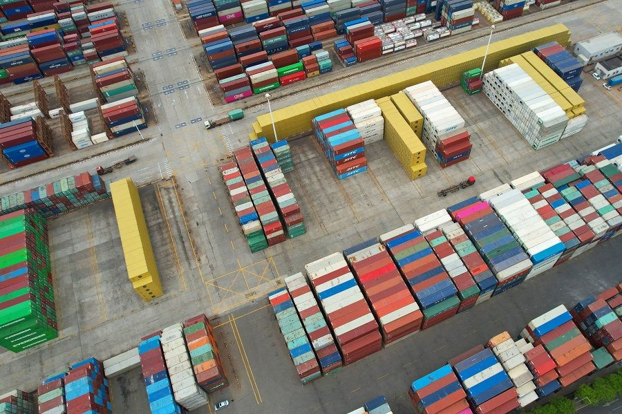 This aerial photo shows cargo containers stacked at a port in Lianyungang, Jiangsu province, China, on 9 May 2022. (AFP)