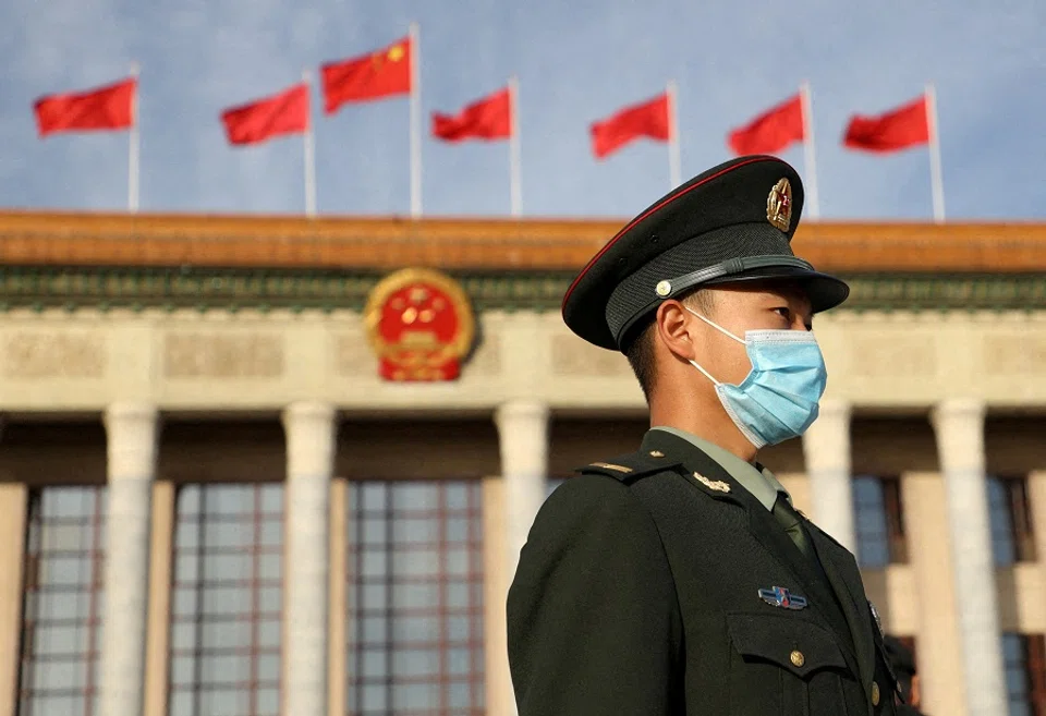 A soldier stands guard at the Great Hall of the People in Beijing, China, on 18 October 2023. (Xiaoyu Yin/Reuters)