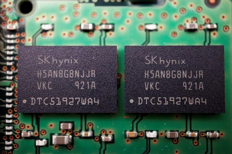 Memory chips by South Korean semiconductor supplier SK Hynix are seen on a circuit board of a computer in this illustration picture taken 25 February 2022. (Florence Lo/Reuters)