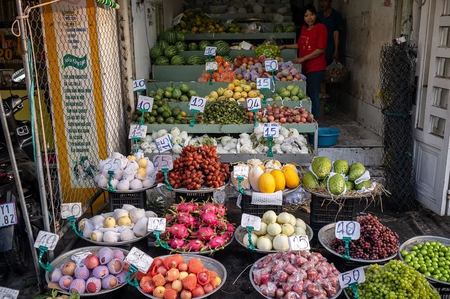 Fruits are displayed for sale at the Tan An wholesale market in Ninh Kieu District, Can Tho City, Vietnam, on 25 April 2024.  (Linh Pham/Bloomberg)