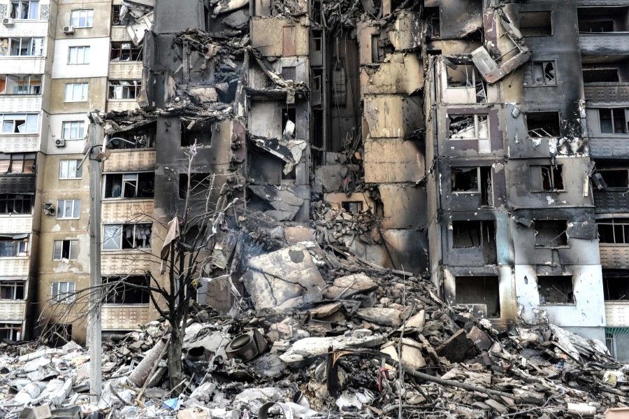 This picture shows an apartment building destroyed after shelling the day before in Ukraine's second biggest city of Kharkiv on 8 March 2022. (Sergey Bobok/AFP)
