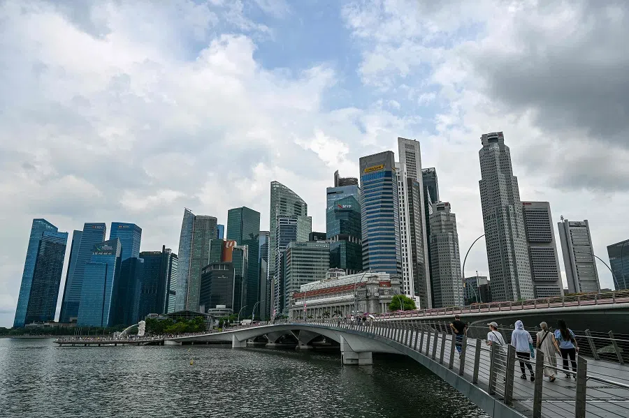 People at the Marina Bay waterfront in Singapore on 13 May 2024. (Roslan Rahman/AFP)