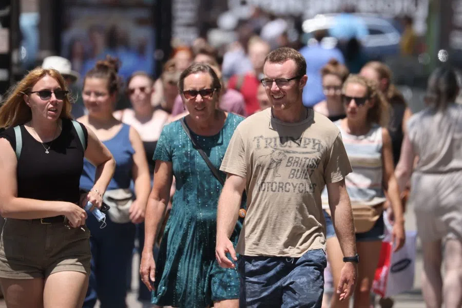 People walk along Michigan Avenue on 11 June 2021 in downtown Chicago, Illinois. (Scott Olson/AFP)