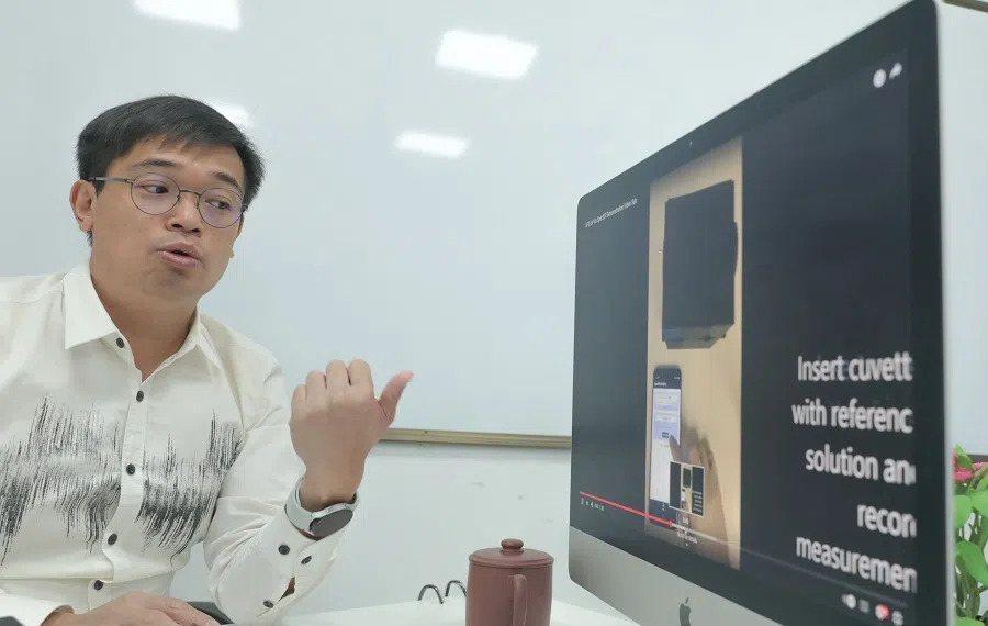 Samuel Gan explaining his research. (Photo provided by interviewee)