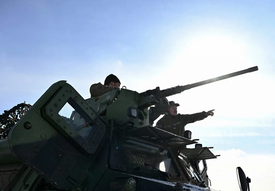 Ukrainian servicemen from the 24th Mechanised Brigade prepare a machine gun on their French made VAB armoured personnel carrier (APC), in an undisclosed location in the Donetsk region on 16 February 2025, amid the Russian invasion of Ukraine. (Genya Savilov/AFP)