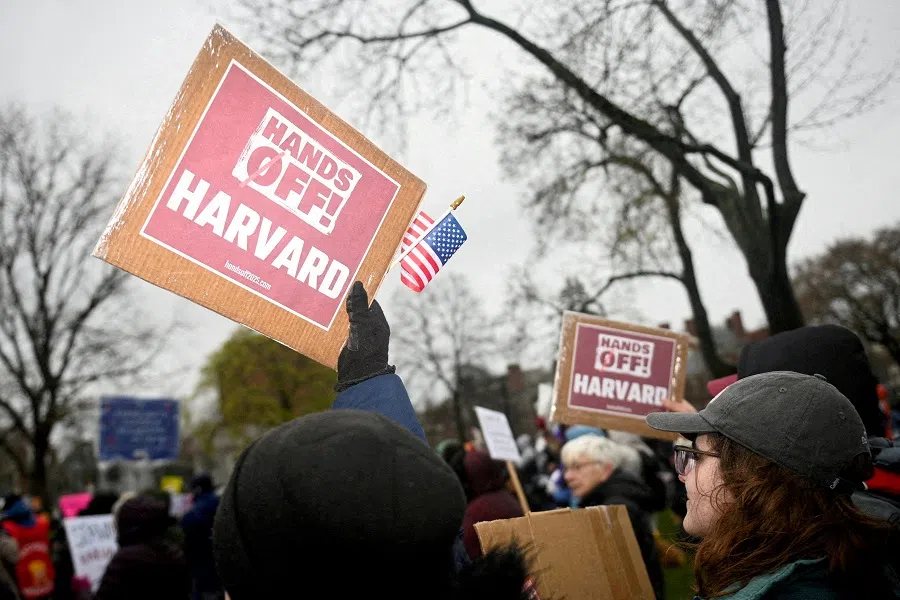 Demonstrators rally on Cambridge Common in a protest organised by the City of Cambridge calling on Harvard leadership to resist interference at the university by the federal government in Cambridge, Massachusetts, US, on 12 April 2025.