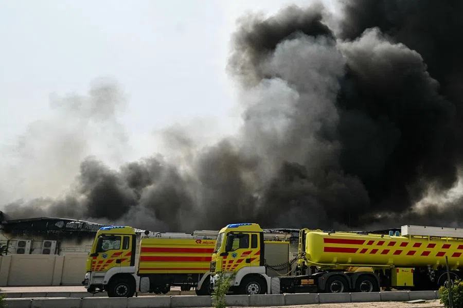 A plume of smoke rises from a reported Iranian strike in the industrial district of Doha on 1 March 2026. (Mahmud Hams/AFP)