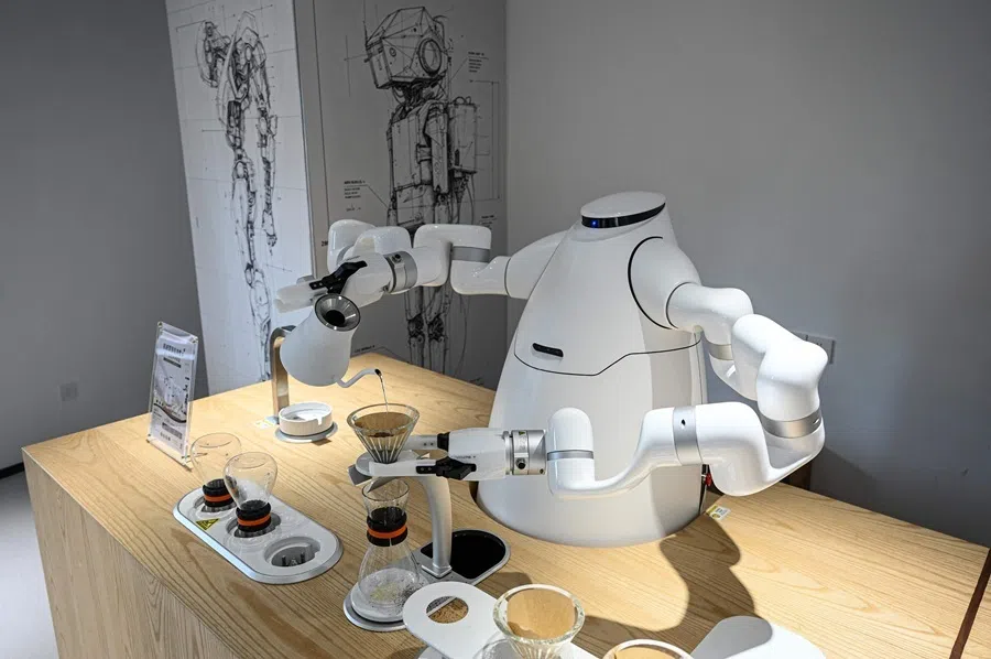 The photo taken on 4 August 2026 shows a robot manufactured by Zhejiang University Robot Research Institute making making coffee at the Hangzhou Robot school in Hangzhou, in eastern China's Zhejiang province.