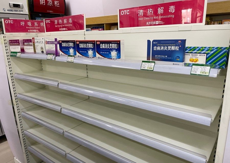 An almost empty shelf of cold medicine at a pharmacy amid the Covid-19 pandemic in Beijing on 15 December 2022. (Yuxuan Zhang/AFP)