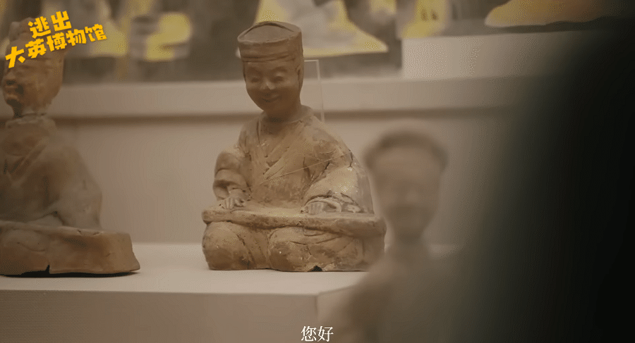 A terracotta figure of a guqin player at a museum in China, an exhibit shown in the video series.
