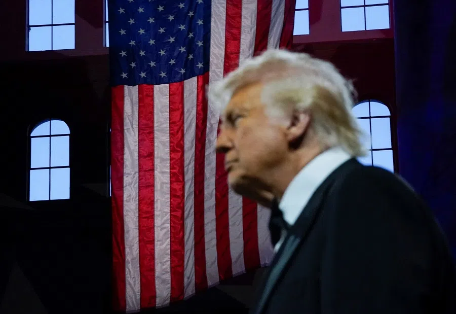 A US flag is pictured in the background as US President Donald Trump attends the National Republican Congressional Committee (NRCC) dinner at the National Building Museum in Washington, DC, US, on 8 April 2025.