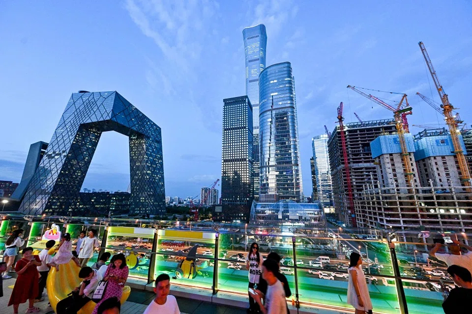 People visit a shopping mall in Beijing, China, on 22 August 2024. (Adek Berry/AFP)