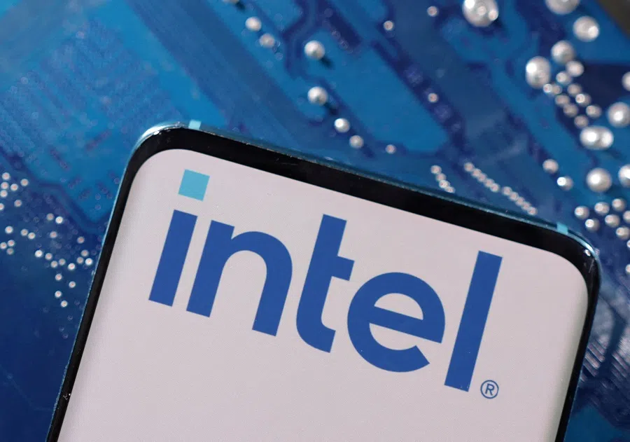 A smartphone with a displayed Intel logo is placed on a computer motherboard in this illustration taken 6 March 2023. (Dado Ruvic/Illustration/Reuters)
