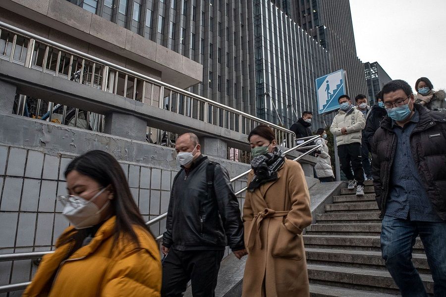 Pedestrians under an underground tunnel in Beijing, China, on 3 February 2023. (Bloomberg)
