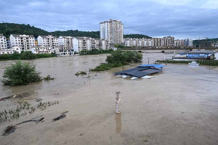 This photo taken on 29 June 2024 shows an aerial view of flooded buildings after a flood peak on the Wuyang river at Qiandongnan, in China’s southwest Guizhou province. (AFP)