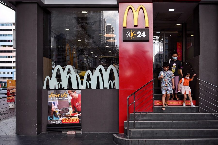 People leave a McDonald's outlet in Singapore, on 18 January 2023. (SPH Media)