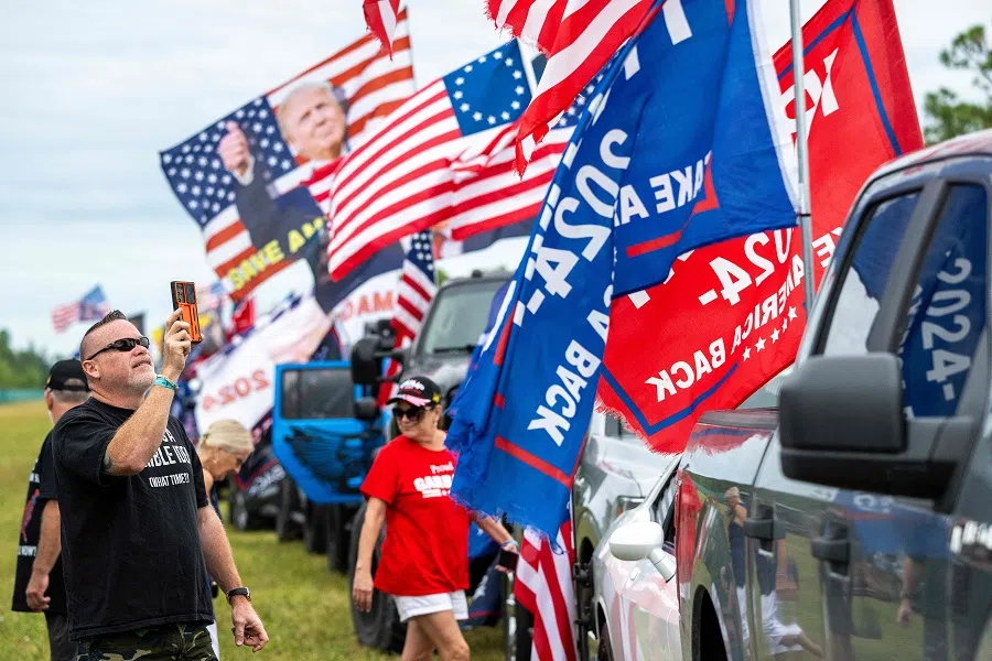 Supporters of US President-elect Donald Trump gather with hundreds of decorated cars and trucks during a Trump Victory Parade in West Palm Beach, Florida, on 17 November 2024.