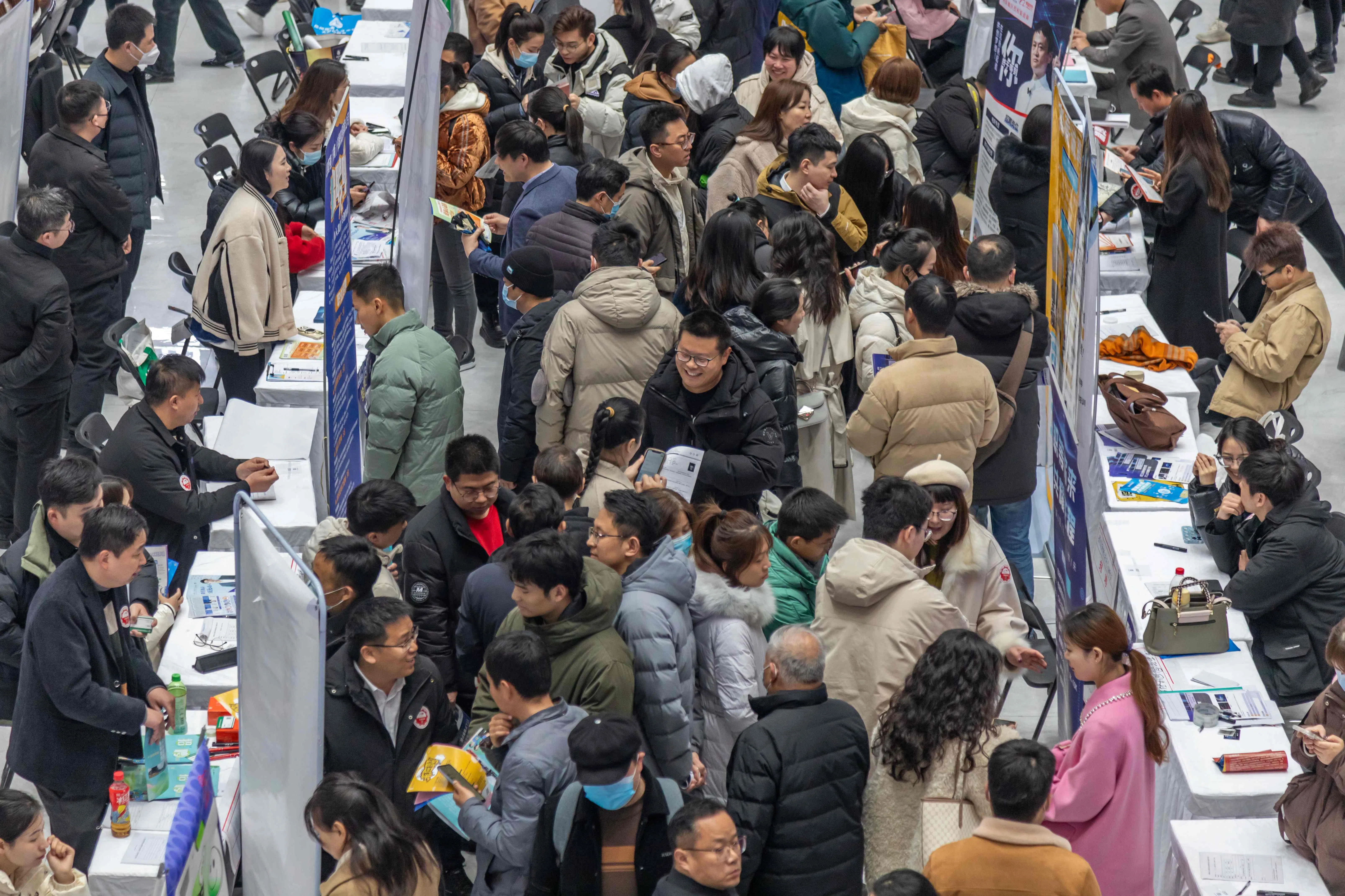 People attend a job fair in Henan, China, on 19 February 2024.