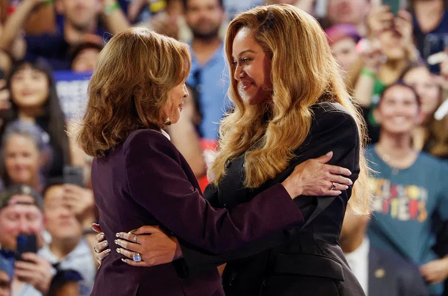 Singer Beyonce (right) and Democratic presidential nominee US Vice-President Kamala Harris embrace as they attend a campaign rally in Harris, Houston, Texas, US, on 25 October 2024. (Marco Bello/Reuters)