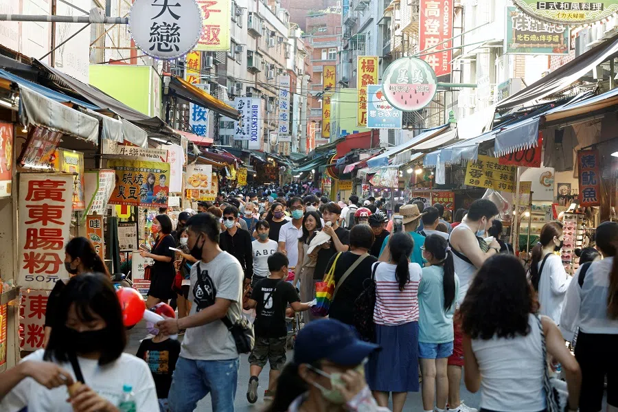 People throng a street in Tamsui district of New Taipei City, Taiwan, 7 August 2022. (Jameson Wu/Reuters)