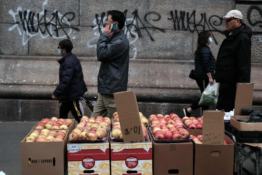 People walk through a busy shopping district in Chinatown on 18 April 2023 in New York City. (Spencer Platt/Getty Images/AFP)