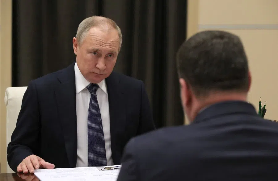 Russian President Vladimir Putin (left) meets Russia's Labour and Social Protection Minister Anton Kotyakov (right) at Novo-Ogaryovo residence, outside Moscow on 4 May 2022. (Mikhail Klimentyev/Sputnik/AFP)