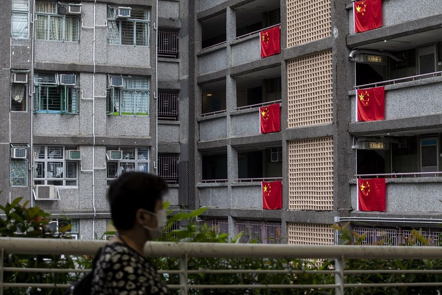 Chinese national flags on display in a public housing block in Wong Tai Sin district to mark National Day in Hong Kong, China, on 1 October 2021. (Paul Yeung/Bloomberg)