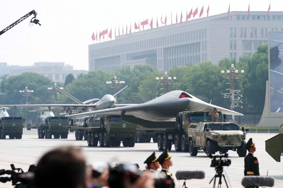 A People’s Liberation Army (PLA) GJ-11 unmanned combat aerial vehicle (UCAV), right, on Chang’an Avenue at Tiananmen Square during a military parade to mark 80 years since Japan’s defeat in World War II held in Beijing, China, on 3 September 2025. (Qilai Shen/Bloomberg)