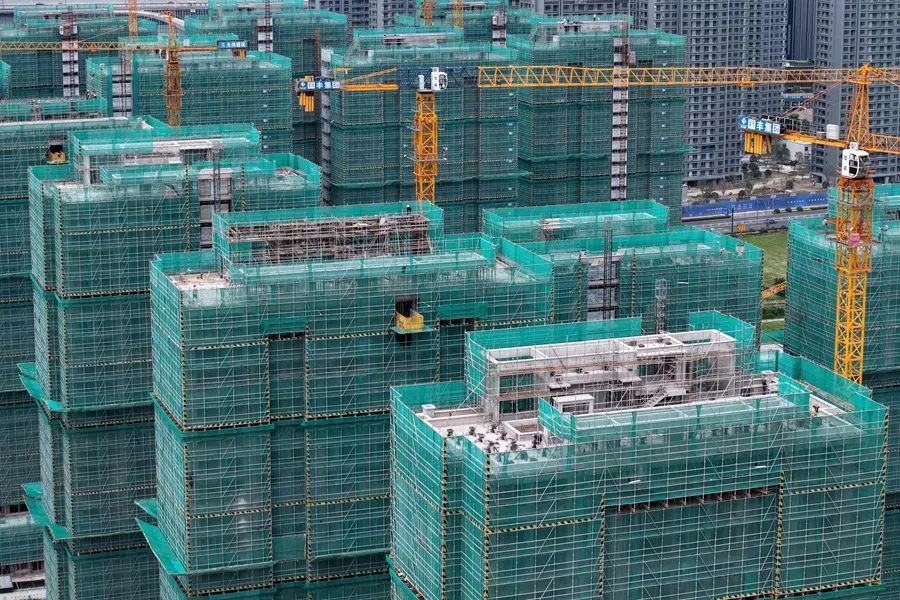 Workers are seen on a residential construction site in Hangzhou, Zhejiang province, China, on 15 July 2025. (AFP)