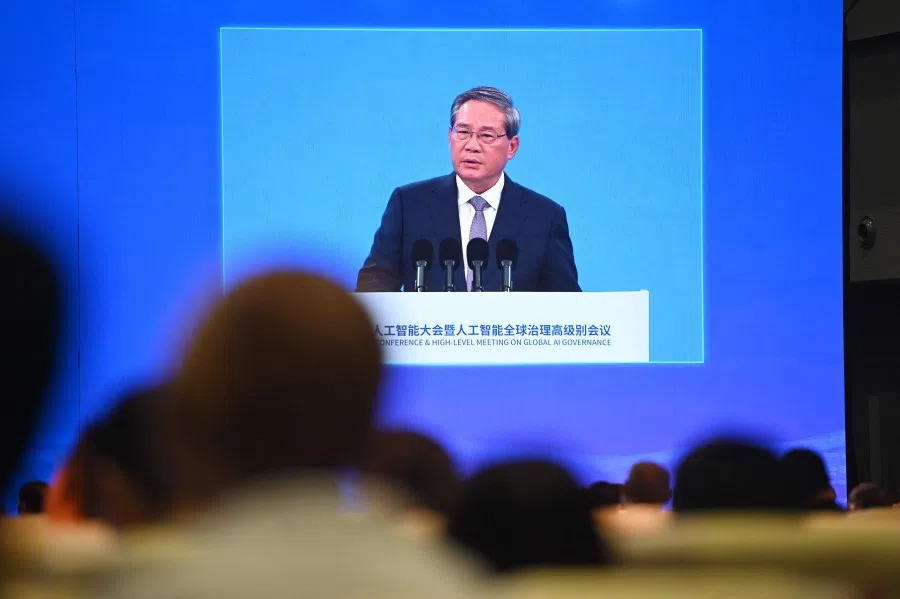 Chinese Premier Li Qiang is seen on a screen as he speaks at the opening ceremony of the World Artificial Intelligence Conference in Shanghai on 26 July 2025. (Agatha Cantrill/AFP)