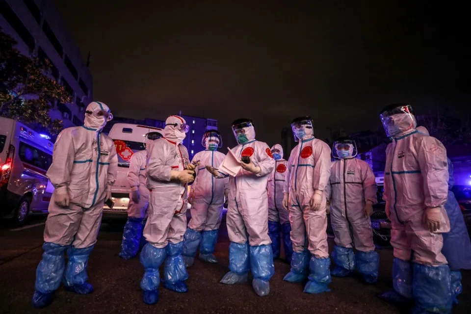 Medical staff prepare to transfer Covid-19 patients from Wuhan No.5 Hospital to Leishenshan Hospital in Wuhan, March 2020. The people of Wuhan are grateful to front line healthcare workers and volunteers. (AFP)