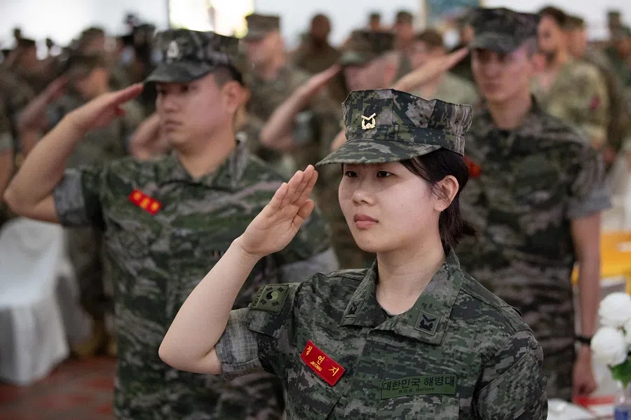 South Korean marines (front) salute during the opening ceremony of the “Kamandag” annual military exercise between the US and Philippines in Manila on 26 May 2025.  (Ted Aljibe/AFP)