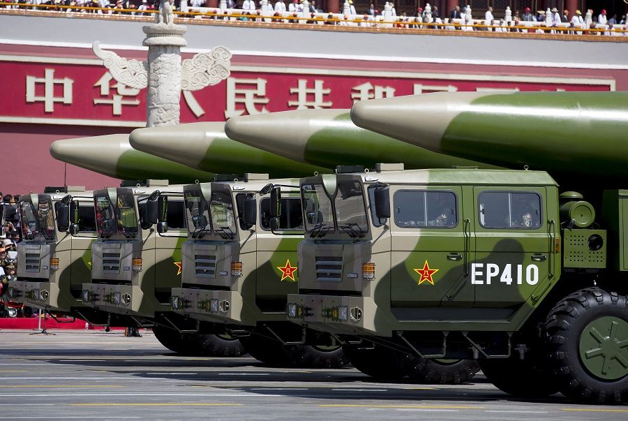 Military vehicles carrying DF-26 ballistic missiles travel past Tiananmen Gate during a military parade to commemorate the 70th anniversary of the end of World War II in Beijing, China, 3 September 2015. (Andy Wong/Pool via Reuters/File Photo)