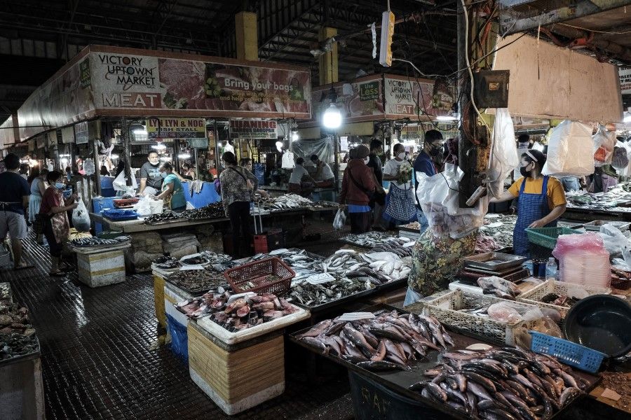 Seafood and meat stalls in a market in Tarlac City, the Philippines, on 24 February 2022. (Veejay Villafranca/Bloomberg)