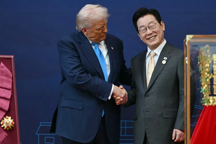 US President Donald Trump shakes hands with South Korean President Lee Jae-myung during a high honour presentation ceremony at the Gyeongju National Museum in Gyeongju on 29 October 2025.