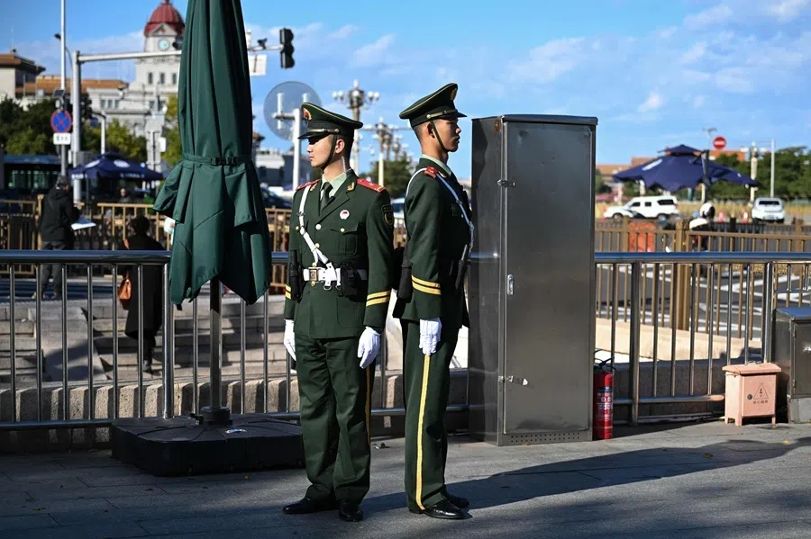 Chinese paramilitary police stand guard at an entrance to the Tiananmen Square during the plenary session of the Communist Party's Central Committee in Beijing on 26 October 2026.