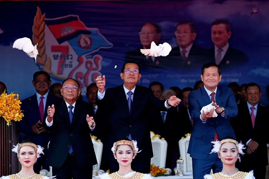 President of the Cambodian People’s Party (CPP) Hun Sen (centre), Honorary president of the CPP Heng Samrin (left) and Cambodia’s Prime Minister Hun Manet (right) release pigeons during a ceremony marking the 45th anniversary of the fall of the Khmer Rouge regime in Phnom Penh on 7 January 2024.
