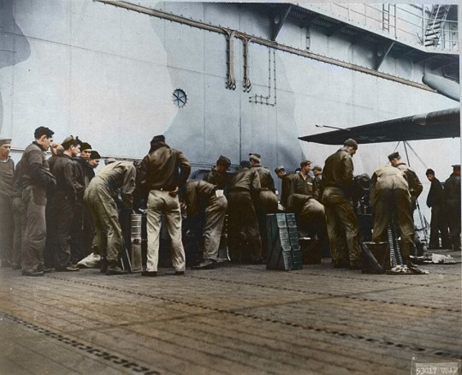 US army personnel making final preparations on the deck of the USS Hornet before the Doolittle Raid.