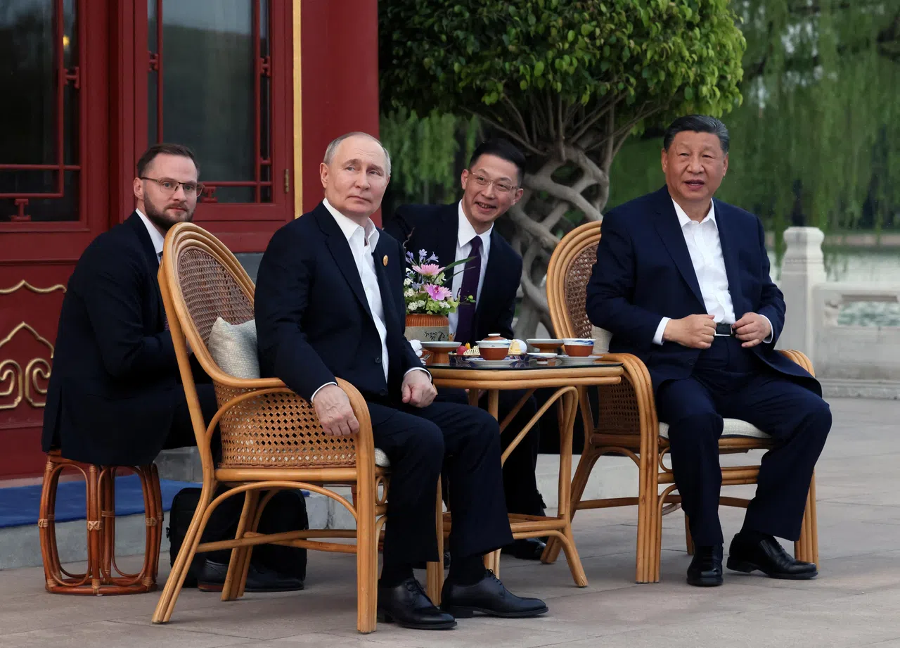 Russian President Vladimir Putin and Chinese President Xi Jinping attend a tea ceremony in Beijing’s Zhongnanhai park, China, on 16 May 2024. (Mikhail Metzel/Sputnik via Reuters)