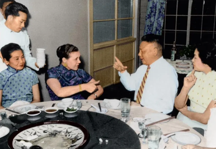 Mr and Mrs Chiang enjoy a finger-guessing game at a family banquet, 1950s. At this time, Faina had been in China with her husband for nearly 20 years. She not only spoke Mandarin but was also fluent in Ningbo dialect, and was the equal of a typical Chinese daughter-in-law, even showing herself a seasoned player at finger-guessing games.