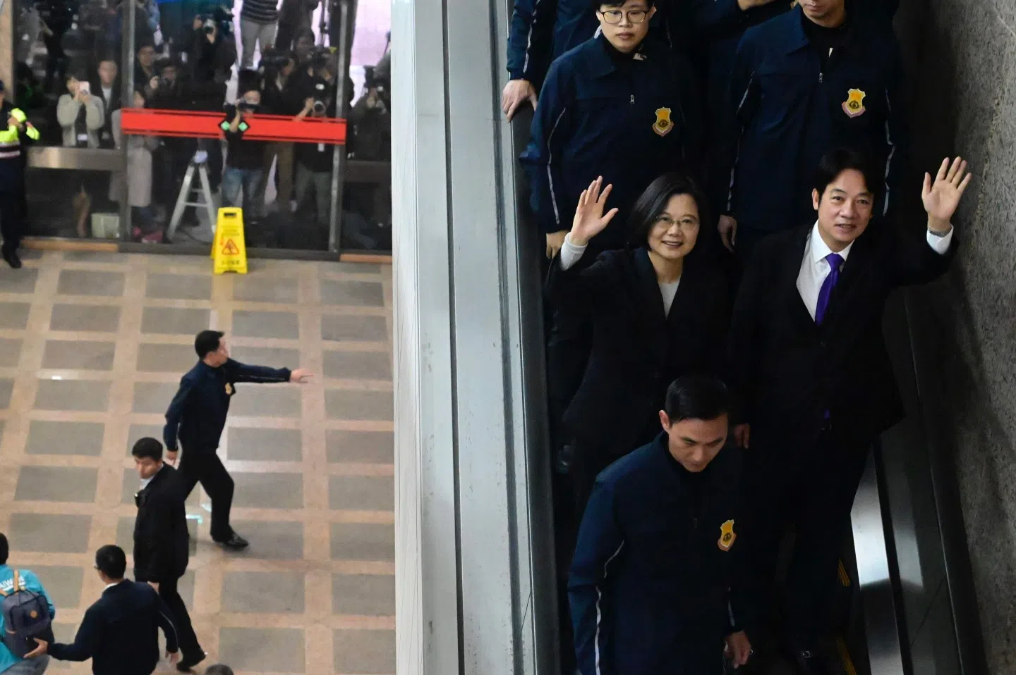 Taiwan's President Tsai Ing-wen (center) and former premier William Lai (centre right) wave after registering as presidential and vice presidential candidates in the upcoming election at the Central Elections Committee in Taipei on 19 November 2019. (Sam Yeh/AFP)