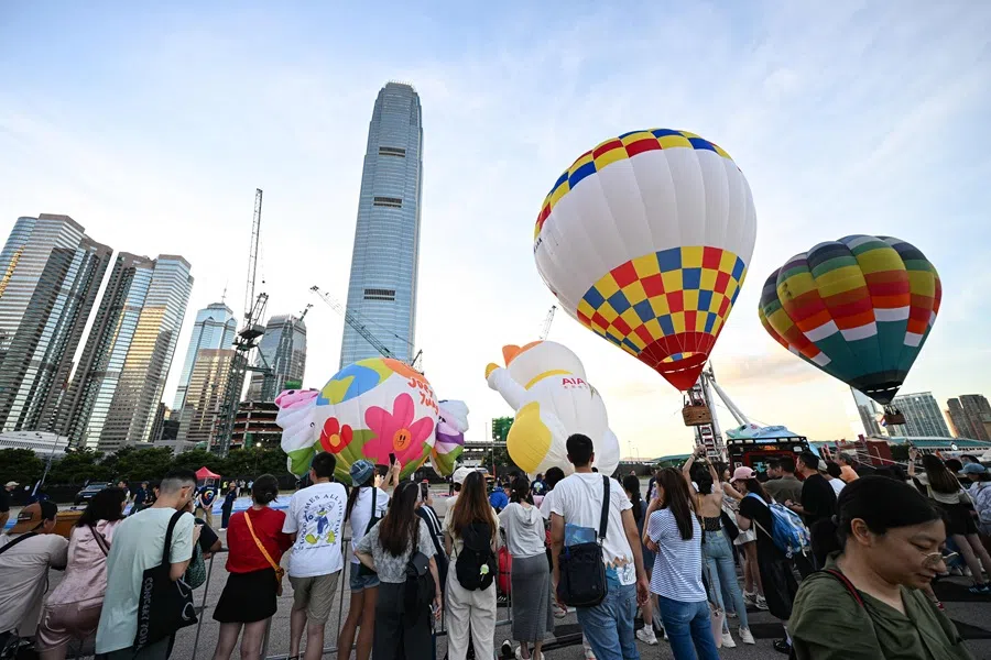 Hot air balloons are seen against the skyline in Hong Kong on 4 September 2025. (Peter Parks/AFP)