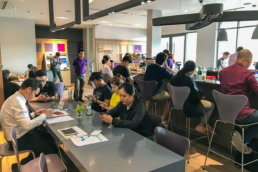 Customers drink coffee while waiting for their turn in Timo, a digital bank and hangout cafe, Ho Chi Minh City, Vietnam. (SPH)