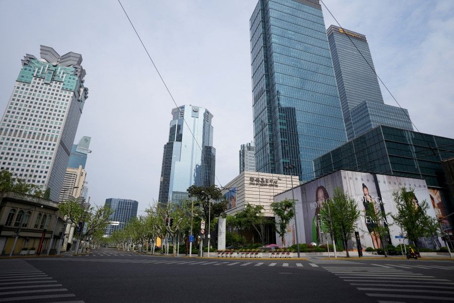 An empty road is seen at Shanghai Central Business District during a lockdown, amid the Covid-19 pandemic, in Shanghai, China, 16 April 2022. (Aly Song/Reuters)