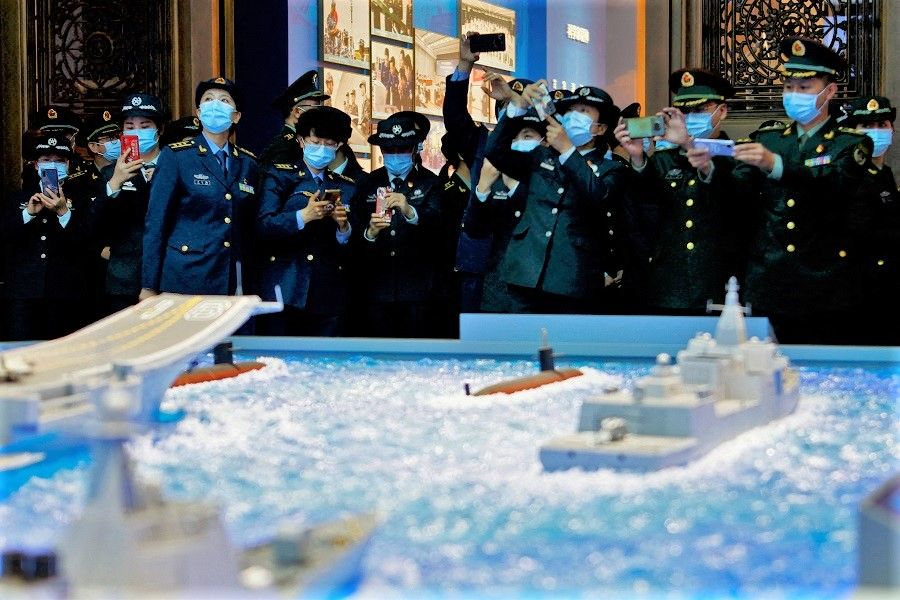 Members of the Chinese People's Liberation Army (PLA) visit an exhibition at the Military Museum of the Chinese People's Revolution in Beijing, China, 8 October 2022. (Florence Lo/File Photo/Reuters)
