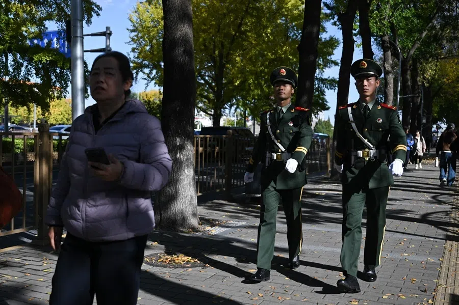 Chinese paramilitary police patrol around Tiananmen Square during the plenary session of the Communist Party's Central Committee in Beijing on 26 October 2026.